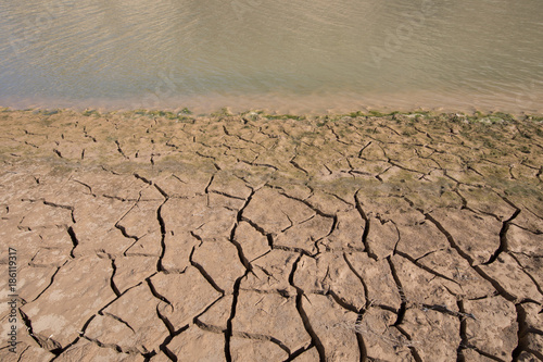 detail of ground with cracked dry land and water, extreme drought in Spain, Europe 