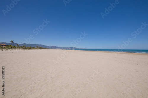 landscape beach of Grao of Castellon named PIne or Pinar  in Valencia  Spain  Europe. Blue clear sky  Mediterranean Sea and Benicassim in the horizon  