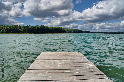 A wooden pier on a lake in Poland.