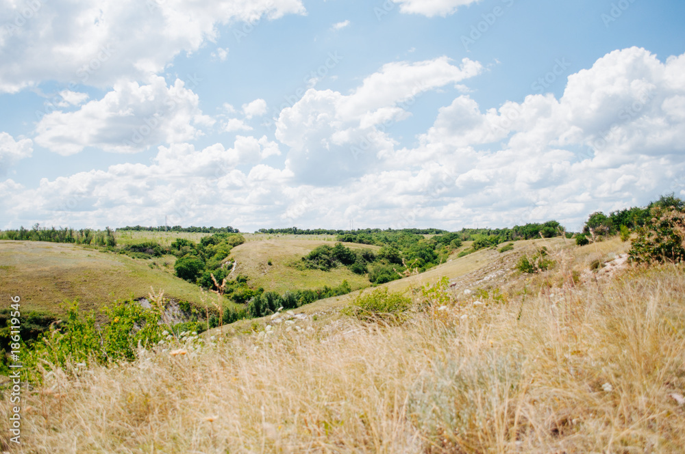 Landscape with summer steppe and cloudy sky in Donbass region of Ukraine Landscape with summer steppe and cloudy sky in Donbass region of Ukraine