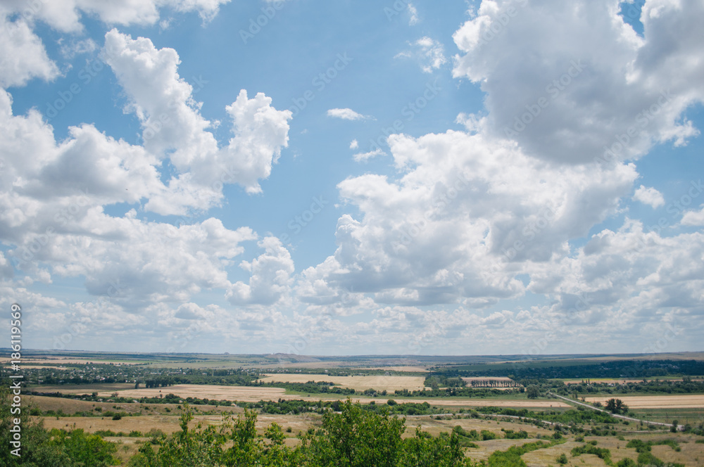 Landscape with summer steppe and cloudy sky in Donbass region of Ukraine