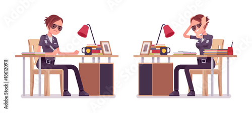 Young policewoman working at desk