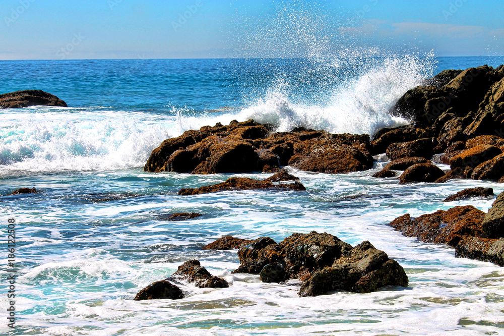 Waves breaking on a rocky shore Waves breaking on a rocky shore