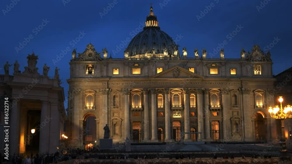 a night close up of the outside of saint peter's basilica in rome, italy a night close up of the outside of saint peter's basilica in rome, italy