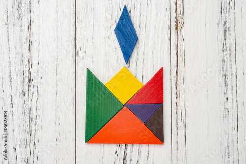 wooden tangram in a candle shape