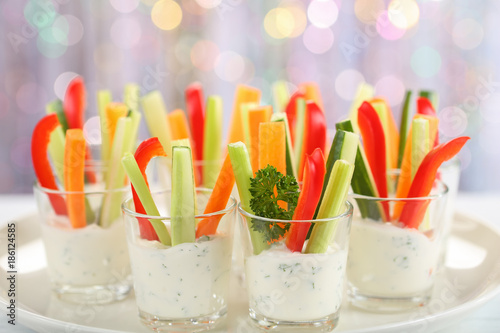 Tela Verrines appetizer with carrot, cucumber, celery and red bell pepper sticks in g