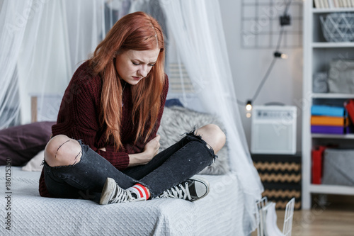 Fotografie Young girl with stomach pain