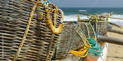 Fototapet detail of fisherman boat , with net and basket
