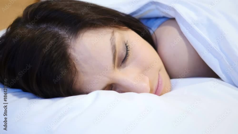 Close up of Young Woman Sleeping in Bed at Night Close up of Young Woman Sleeping in Bed at Night