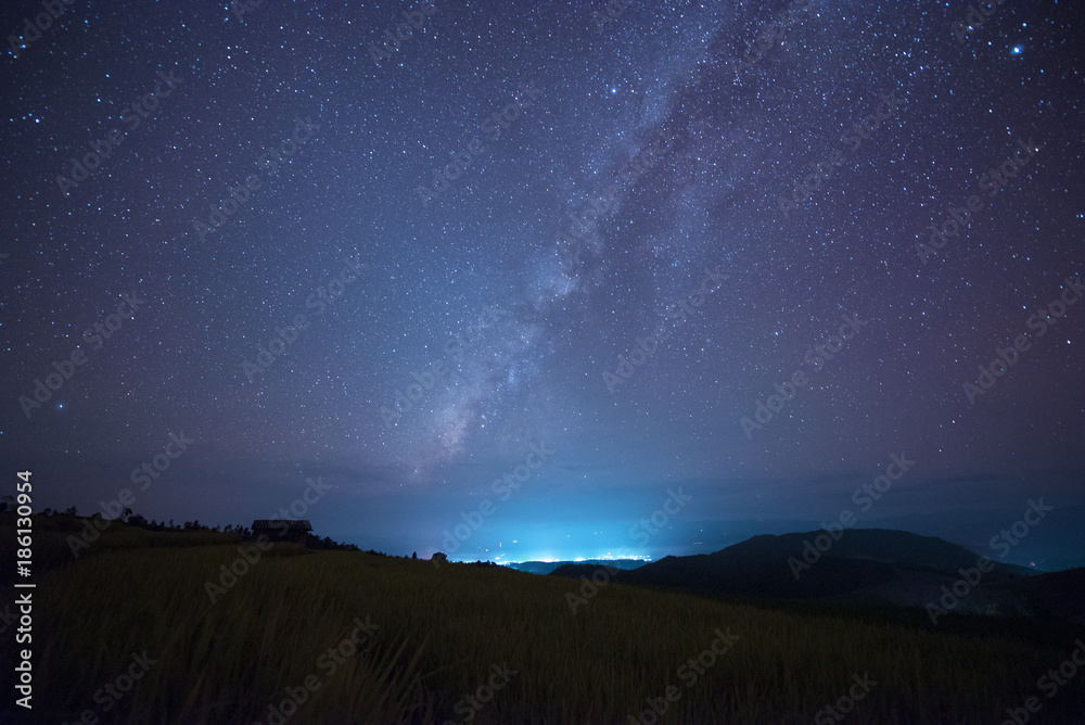 Milky way over landscape view at night.