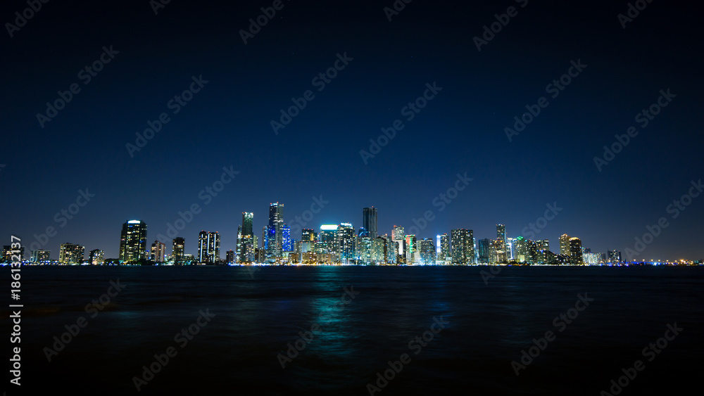 Obraz premium USA, Florida, Miami City Skyline at night with waterfront and reflections