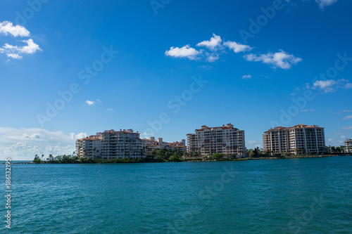 USA, Florida, Miami Houses at waterfront with palm trees near miami beach