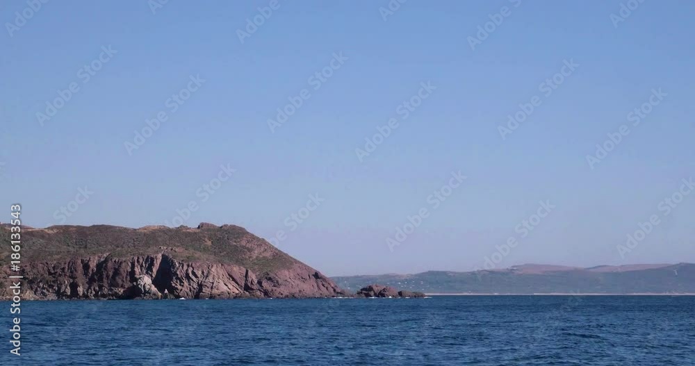 Video shot of Tuerredda beach on a beautiful day with sea and boat in view Video shot of Tuerredda beach on a beautiful day with sea and boat in view