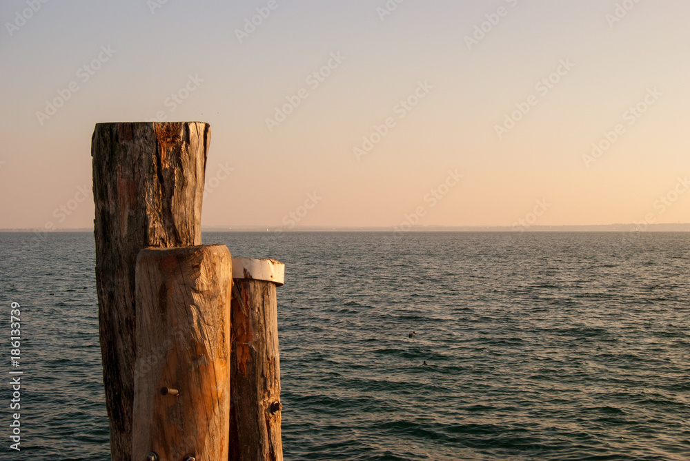 Garda Lake Italy, horizon line on Garda lake near sunset. Garda Lake Italy, horizon line on Garda lake near sunset.