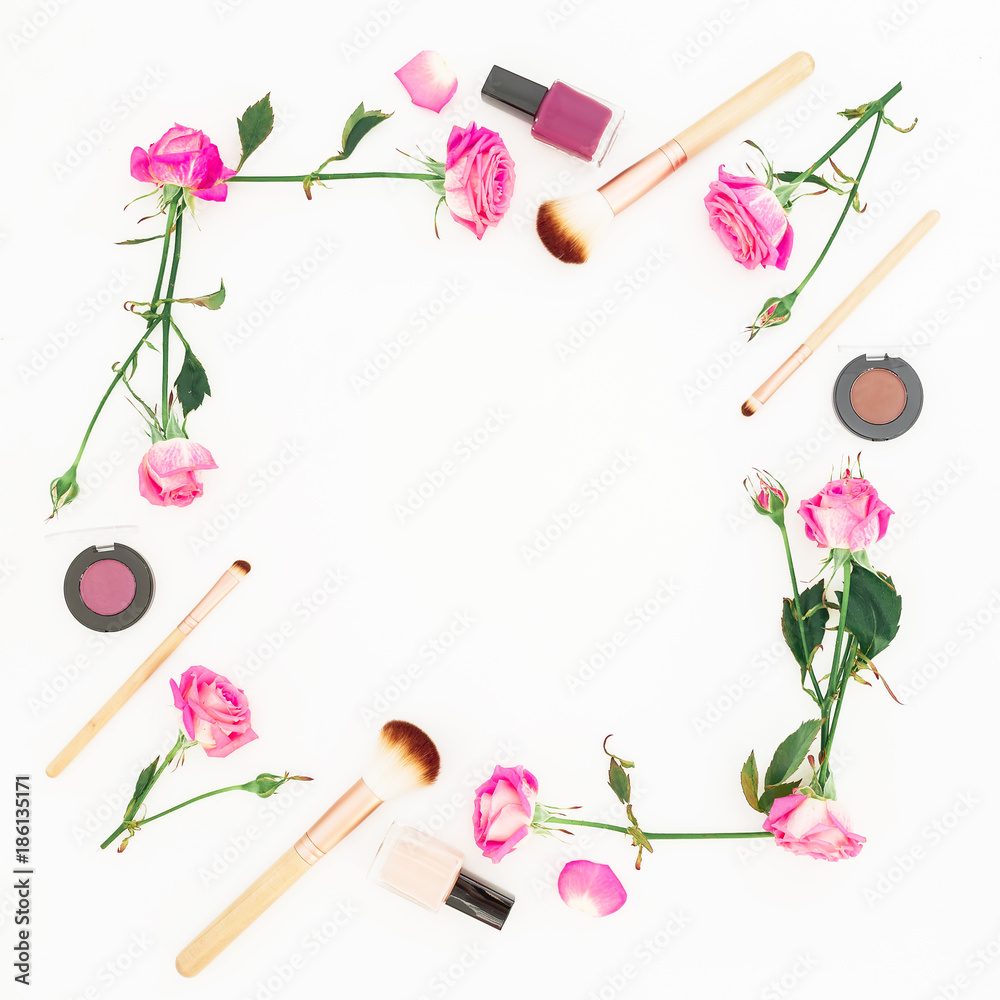 Obraz premium Feminine composition with pink roses and cosmetics on white background. Beauty concept, floral frame. Flat lay, Top view.