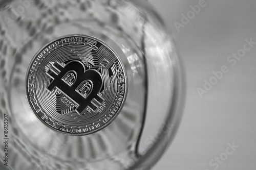 coins bitcoins in a wine glass,close-up