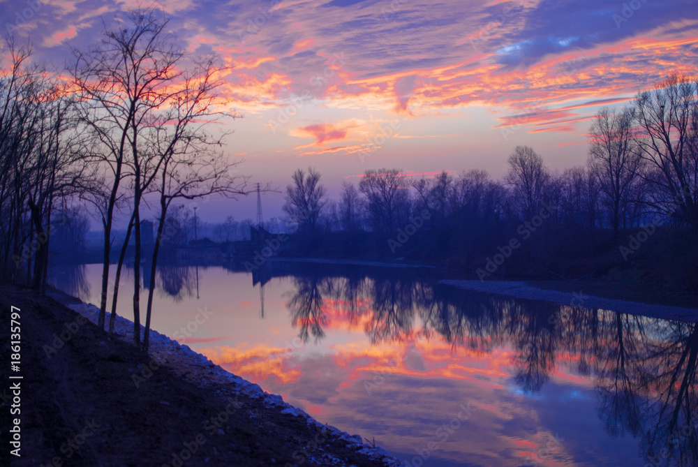 Brescia Italy, beautiful colors of the sunset on the river.