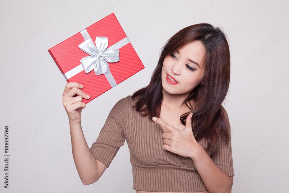 Young Asian woman with a gift box. Young Asian woman with a gift box.