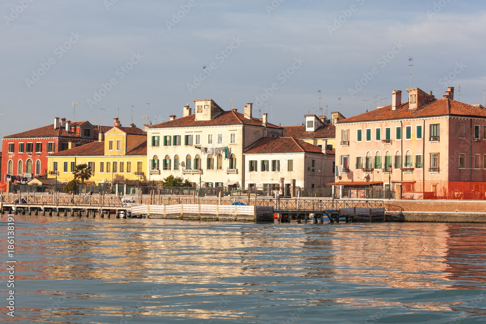 Colorful houses on San Pietro di Castello at dusk, Castello, Venice, Italy with reflections on the lagoon