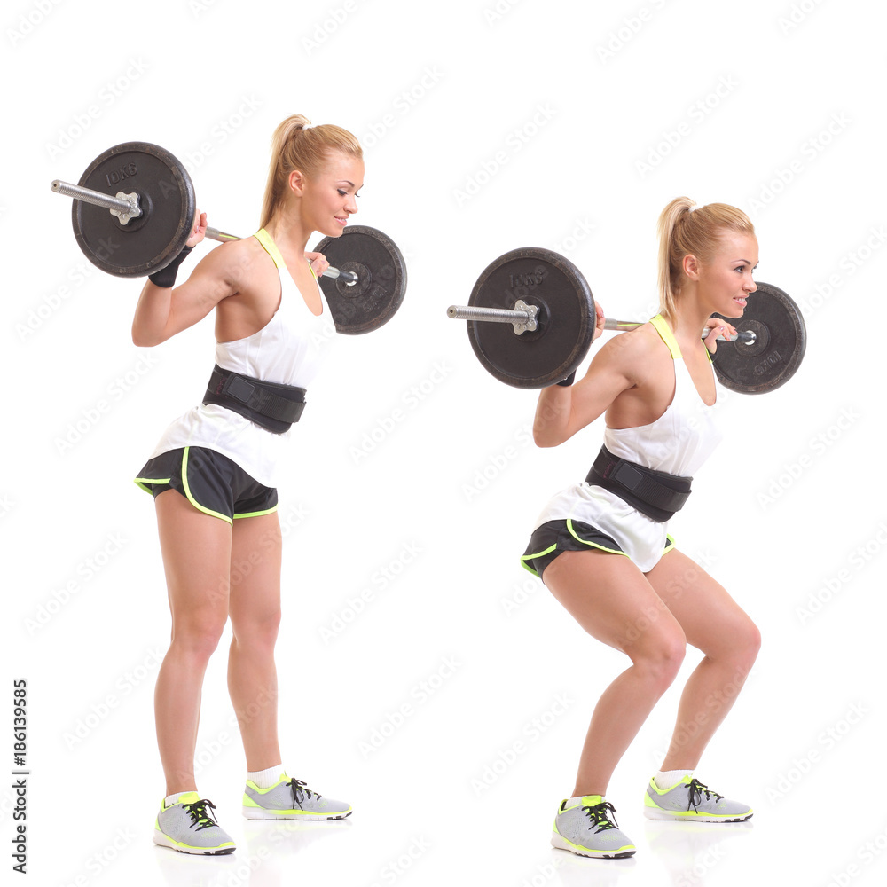 Obraz premium girl with a barbell on a white background