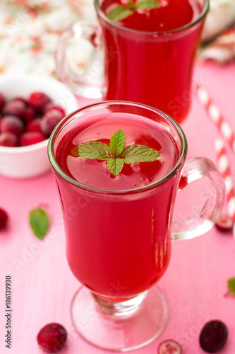 Russian traditional drink kissel with cranberries and mint