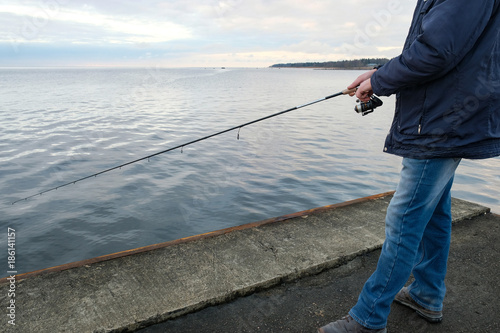 fishermen catch fish on the pier