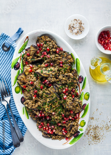 Vegan salad of lentils and eggplant grilled with pomegranate seeds and parsley. healthy food