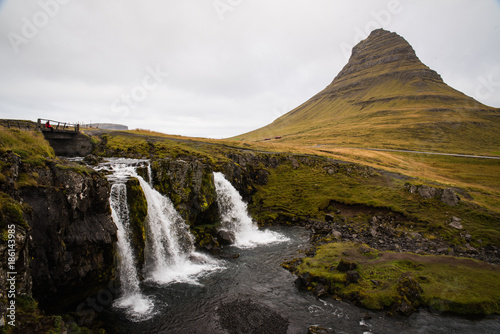 Waterfalss in front of a large mountains in Iceland during a rainy day. 