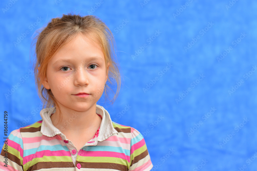 Studio shot of young preteen 9-10 year old redhead girl wearing heart shape sunglasses, standing against blue purple background, big thumbs up Studio shot of young preteen 9-10 year old redhead girl wearing heart shape sunglasses, standing against blue purple background, big thumbs up