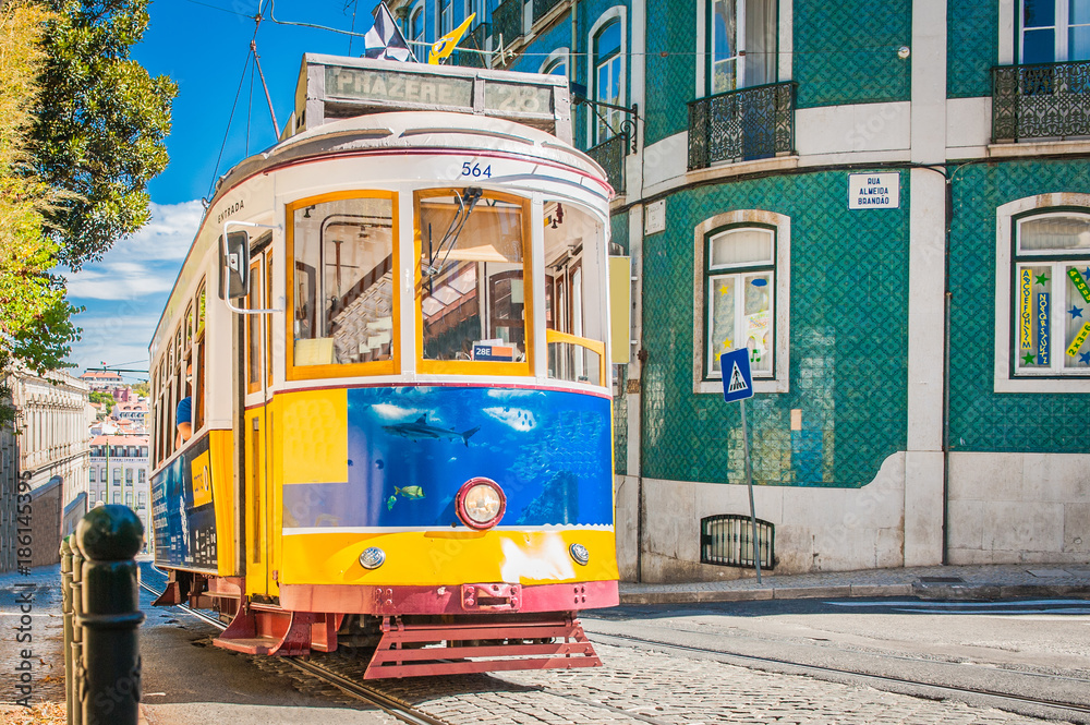 Yellow tram 28 on streets of Lisbon, Portugal