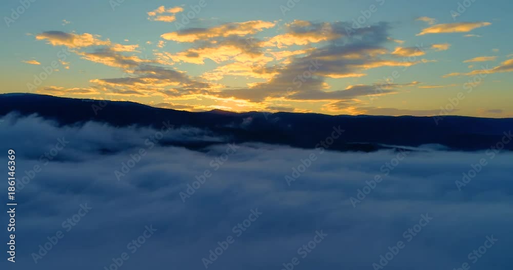 Aerial View. Flying over the clouds . Aerial camera shot. During the sunset. Landscape panorama. Aerial View. Flying over the clouds . Aerial camera shot. During the sunset. Landscape panorama.