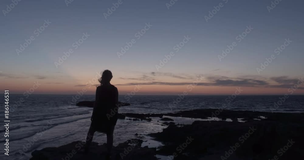SARDINIA, ITALY – JULY 2016 : Video shot of a woman enjoying beautiful view over Arutas Beach during amazing sunset SARDINIA, ITALY – JULY 2016 : Video shot of a woman enjoying beautiful view over Arutas Beach during amazing sunset