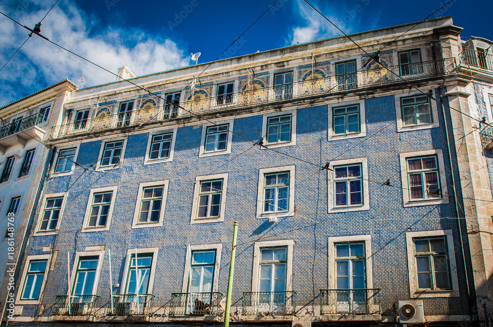 Blue-white wall tiles in Lisbon in Portugal on telenemnt house