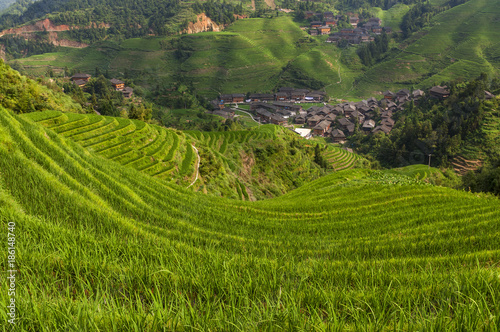 Beautiful view of the Dazhai village and the surrounding Longsheng Rice Terraces in the province of Guangxi in China; Concept for travel in China