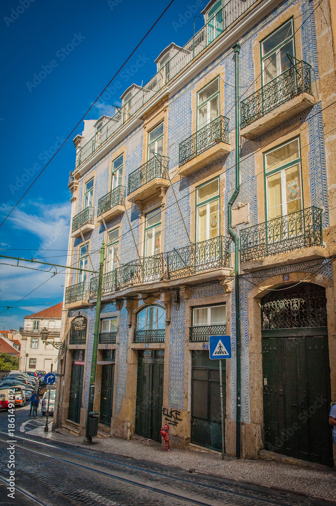 Blue-white wall tiles in Lisbon in Portugal on telenemnt house