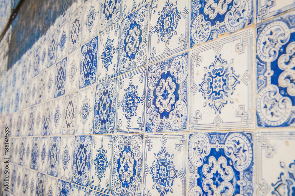 Blue-white wall tiles in Lisbon in Portugal on telenemnt house