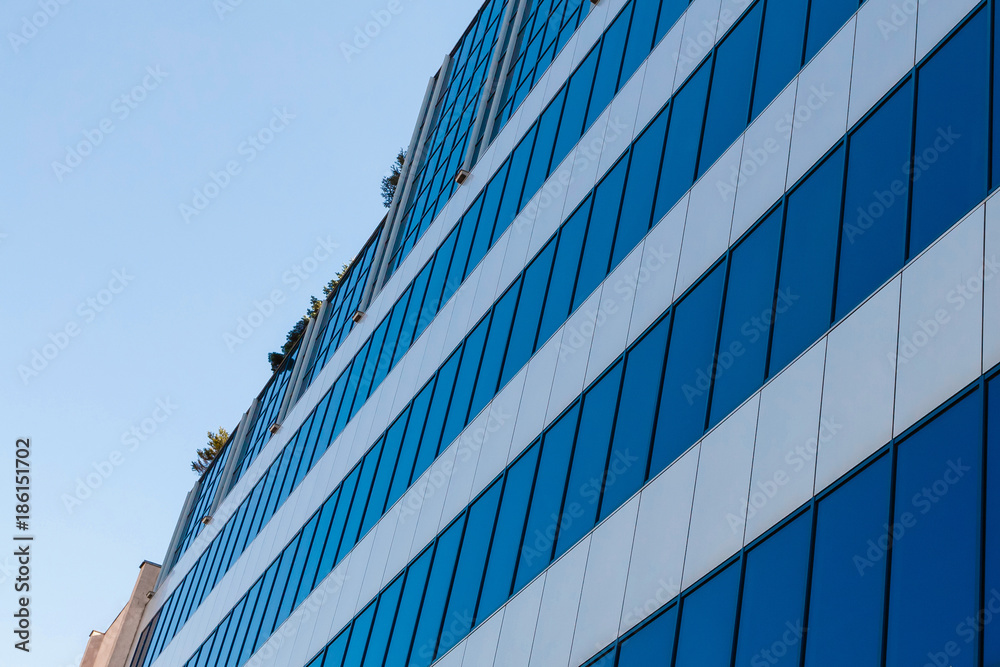 Fototapeta premium Office building blue glass wall