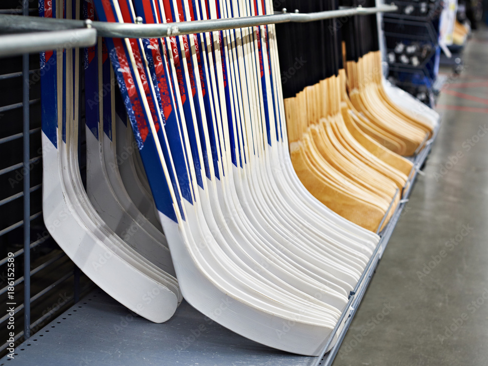 Naklejka premium Hockey sticks in sport shop