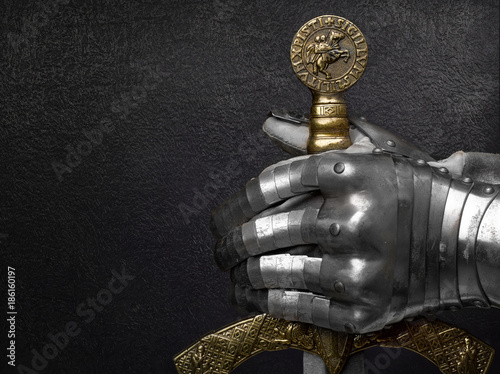 Fotografie A hand in an ancient knight's glove.