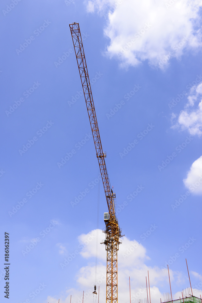 Is operation of the crane under the blue sky Is operation of the crane under the blue sky
