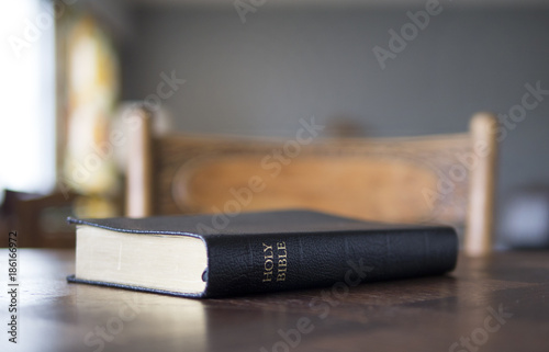 Closed Bible on table. photo