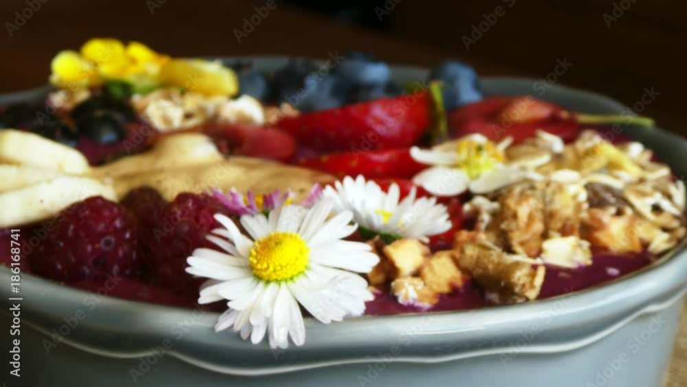 rotating acai berry bowl with fruits, close rotating acai berry bowl with fruits, close