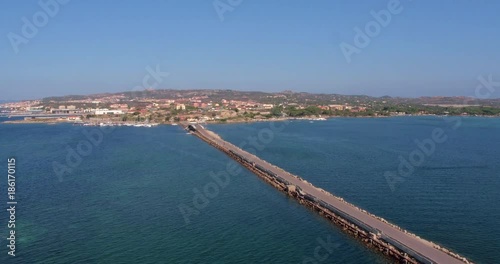 Wallpaper Mural SARDINIA, ITALY  – JULY 2016 : Aerial shot of Isola Maddalena bridge on a sunny day with sea and cityscape in view Torontodigital.ca