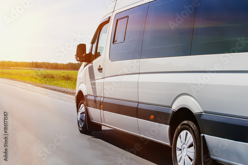 minibus goes on the country highway photo