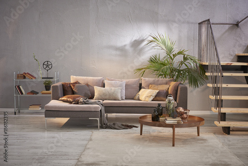 Fototapeta Naklejka Na Ścianę i Meble -  modern grey stone wall luxury living room and interior design with metal stair