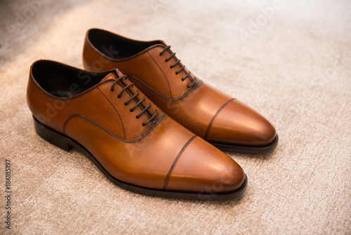 Brown leather classic male shoes on the floor