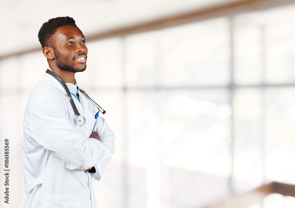African american doctor with a stethoscope standing against blurred background
