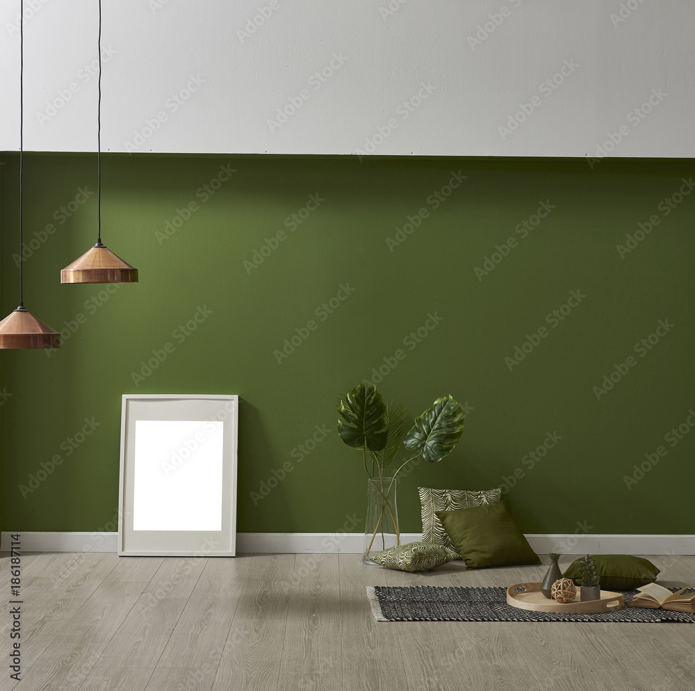 green wall white wall frame vase of flowers and pillow style