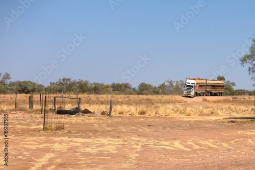Road train loaded with cattle arrives at a rest area near Boulia in Outback Queensland