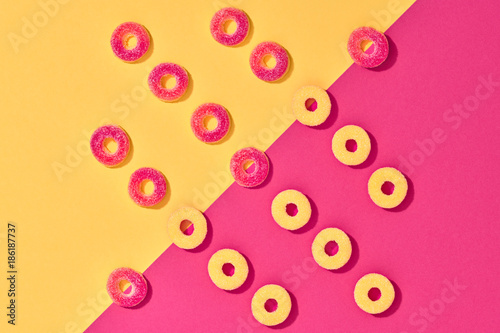 Gummy Candies background, Sweets. Flat lay. Summer Party, Pink Birthday Layout. Bright Colorful. Fun Trendy fashion Style. Minimal. Pop Art